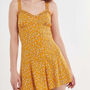 Urban Outfitters yellow romper w cute white flowers!